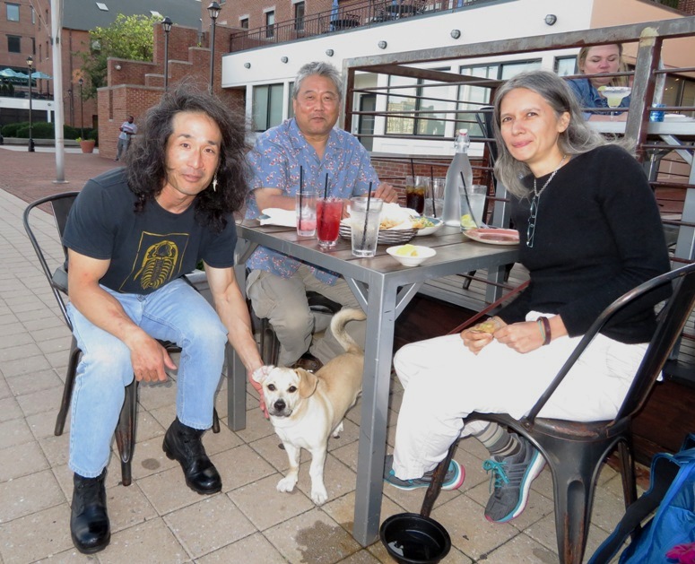 The four of us at an outdoor dining table