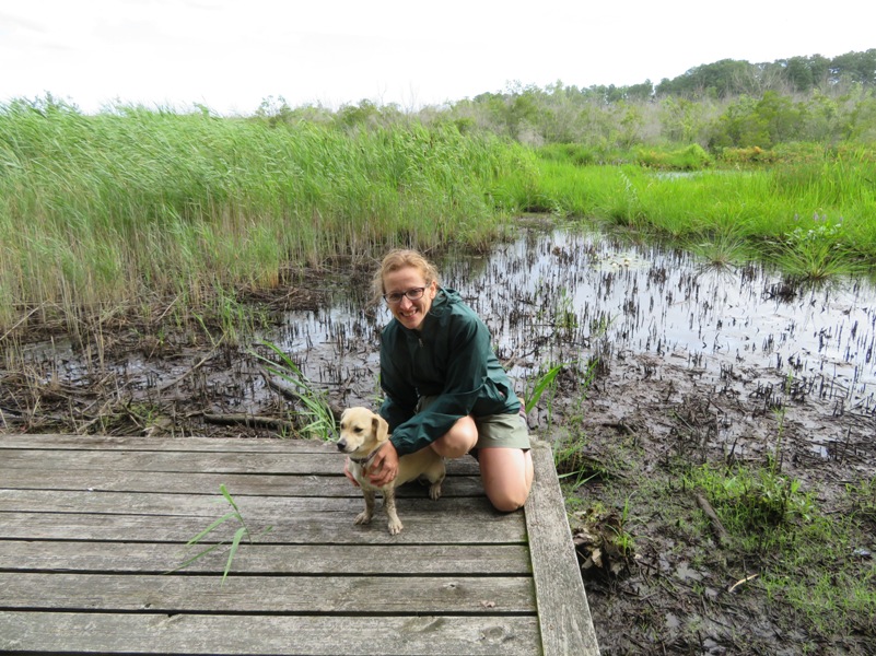 Norma with a muddy Daphne on a wooden platform