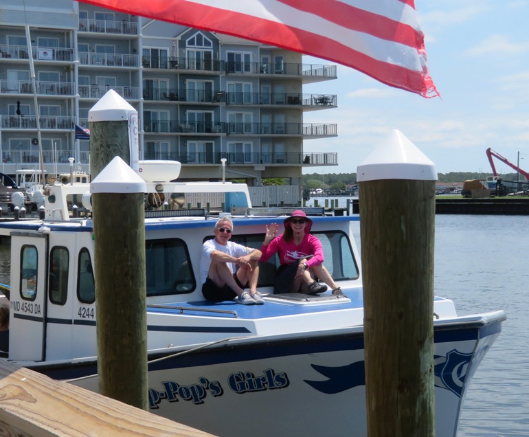 Charley and Ginzy sitting at the front of the boat