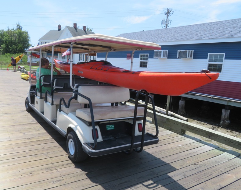 Orange kayak on golf cart