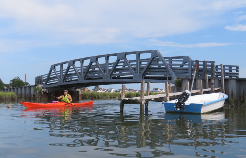 Jessica kayaking under bridge