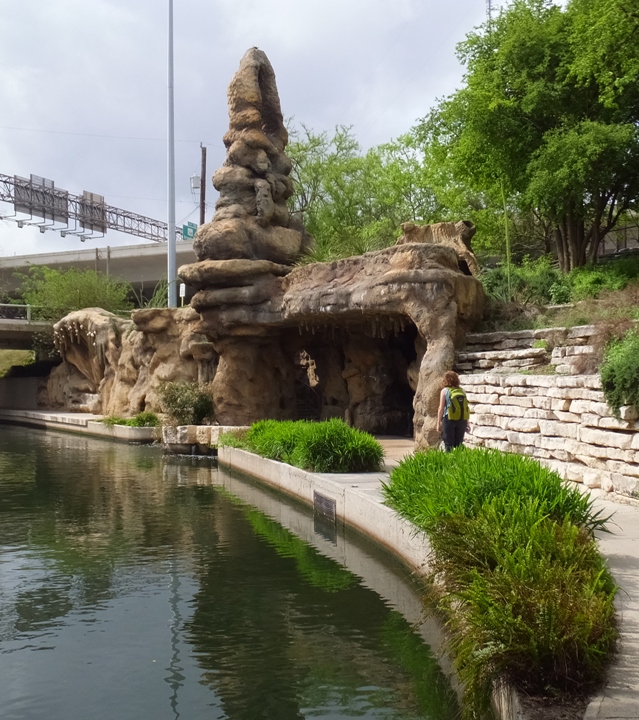 Norma walking near the Grotto and the water