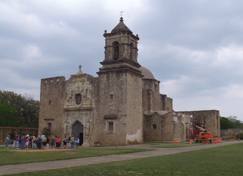 A line of people outside Mission Concepcion