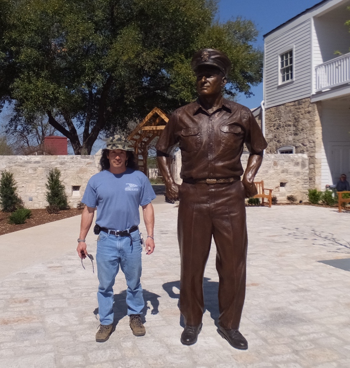 Me standing next to statue of Admiral Chester W. Nimitz