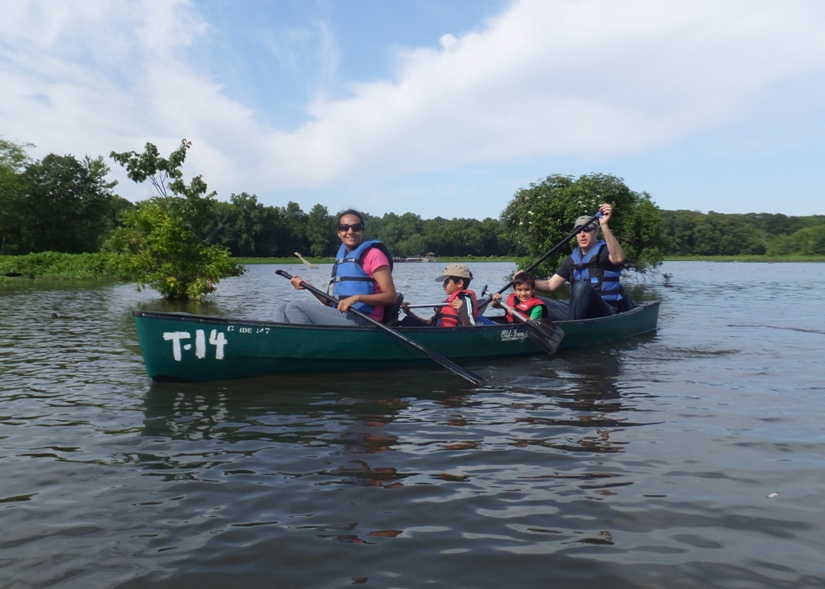 Rekha, Harald, and sons in a canoe