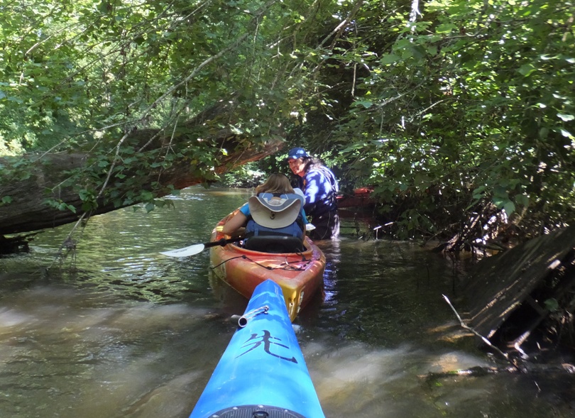 Me helping Stacy and her granddaughter navigate under a log