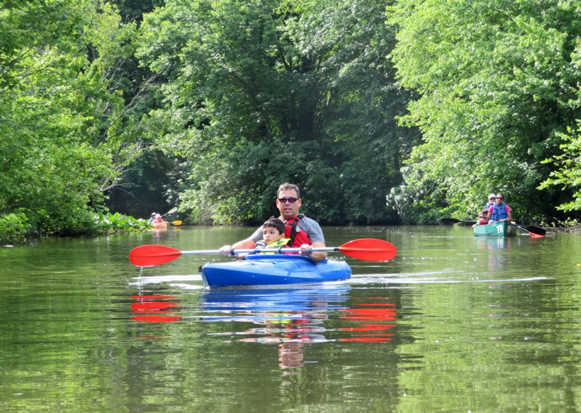 Federico in kayak with his son on his lap