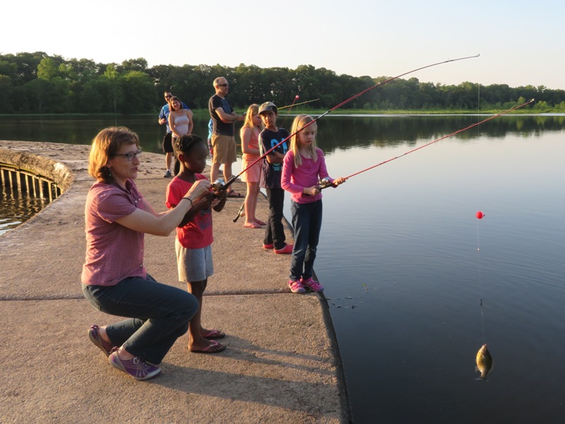 Norma and her niece with a fish on her line