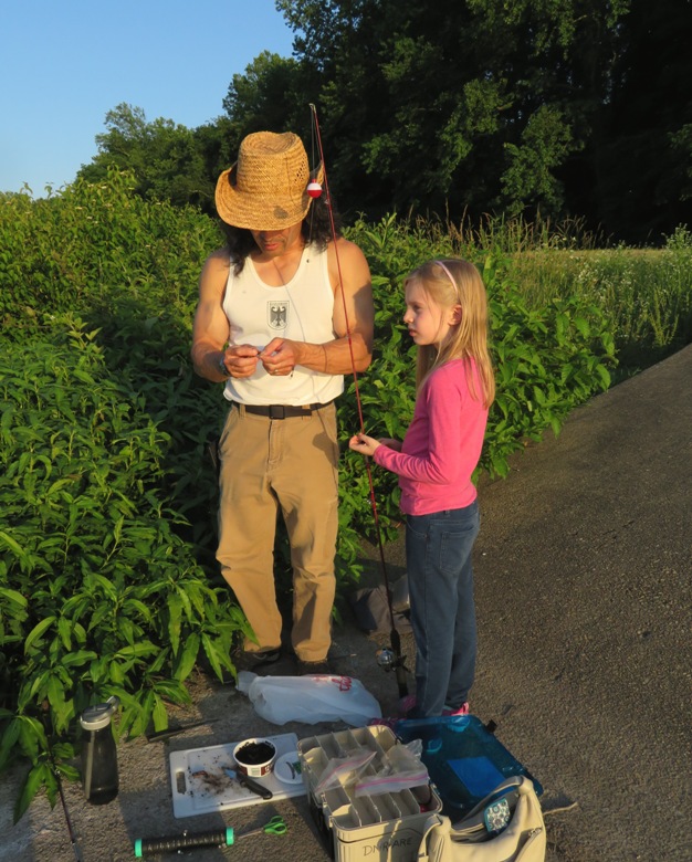Me helping Mark and Allison's daughter put a worm on her hook