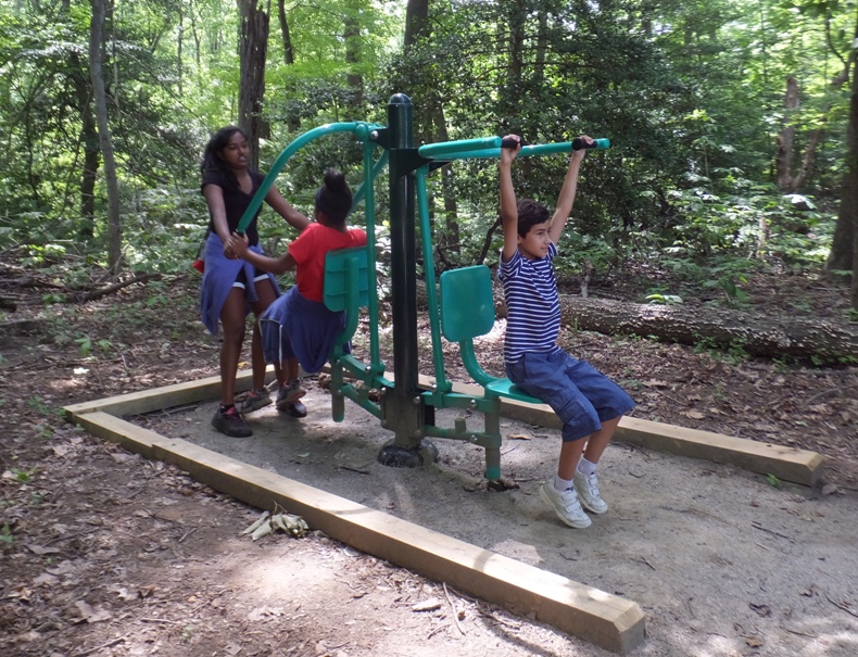 Three kids at fitness station