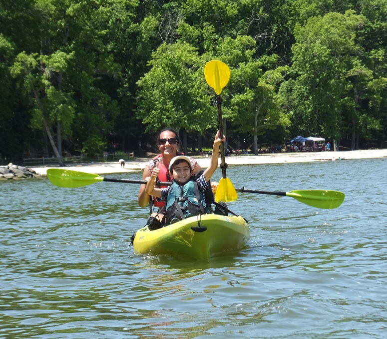 Rekha and her older son in a tandem kayak