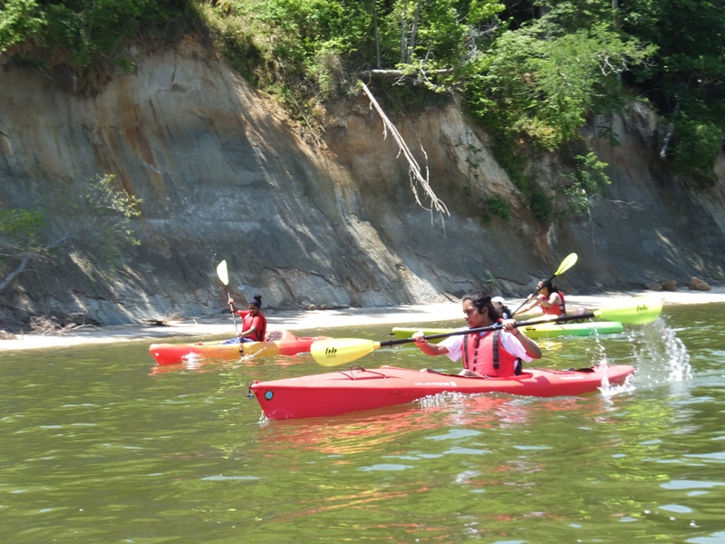 Malar's three girls in single kayaks
