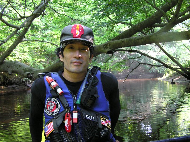 Me on kayak in shaded, wooded area