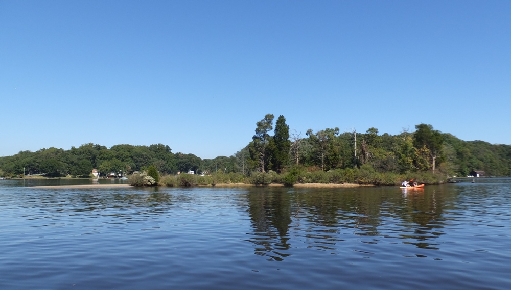 Kayakers near medium-sized island