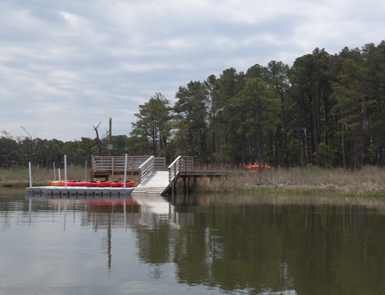 Kayak launch, floating pier with kayaks, and boardwalk