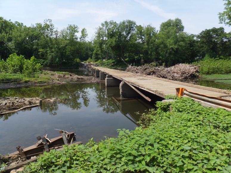 Broken bridge passing over the water