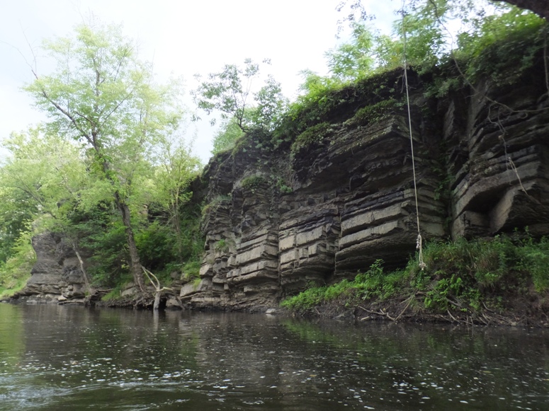 Rocky walls along the river with rope swing