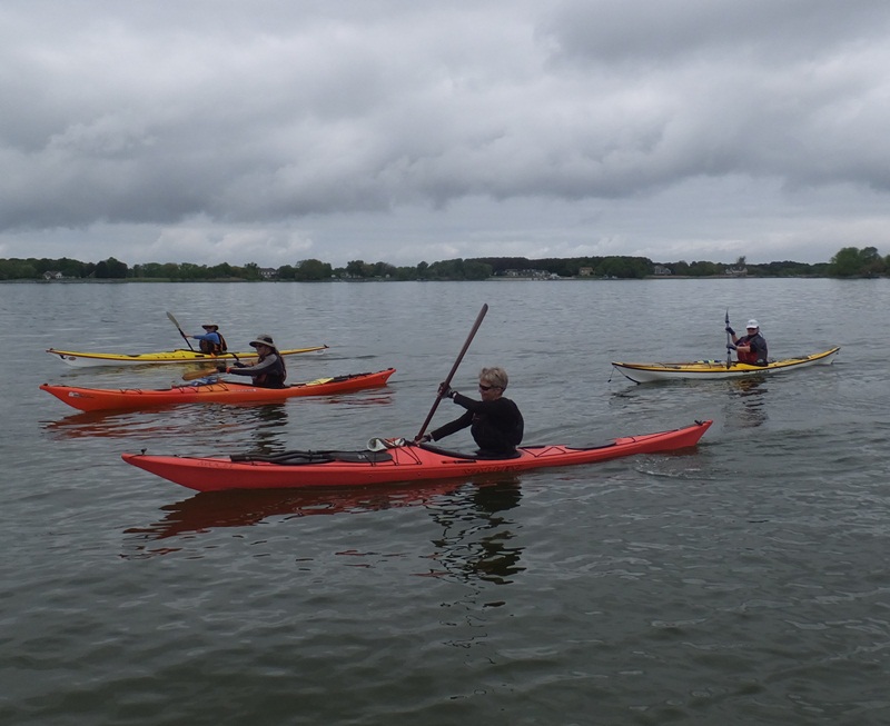 Sue B. kayaking with a high angle stroke