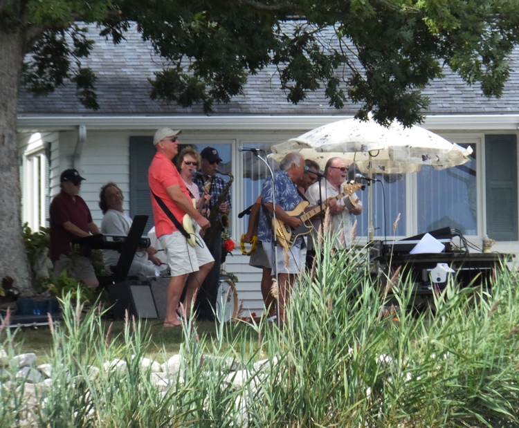 Band performing in someone's back yard
