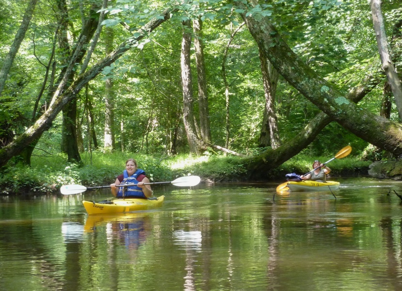 Julia and Stacy kayaking after swapping boats