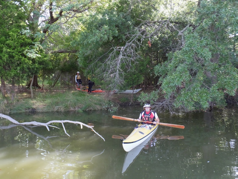 Kayaker on the water near the shore