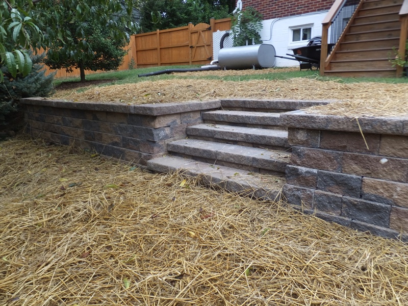 Different view of retaining wall, steps, and straw