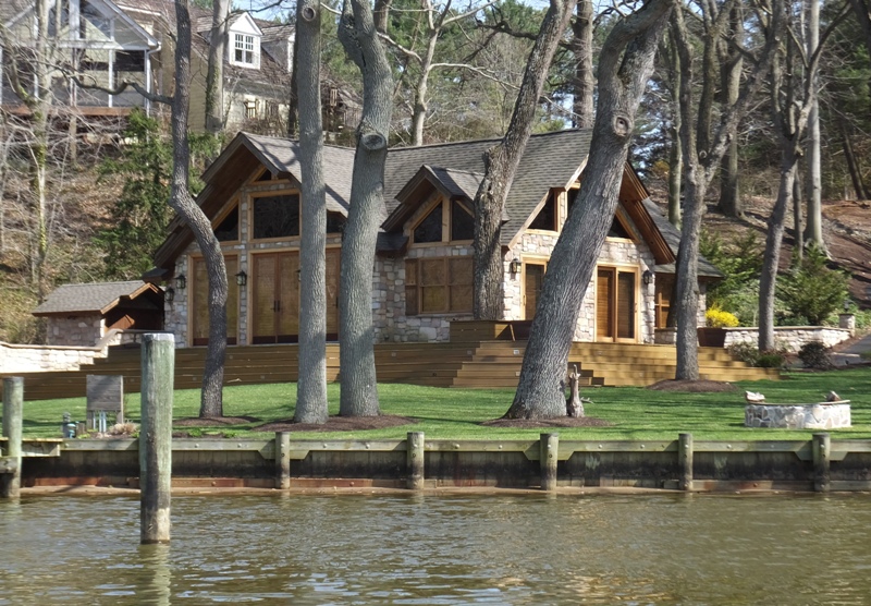 Stone and glass house by the water