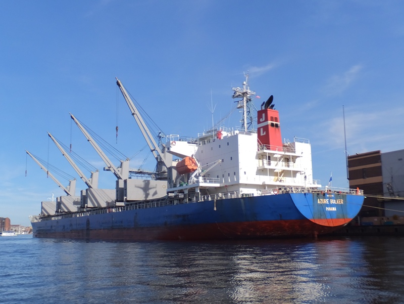View of four cranes hanging over the side