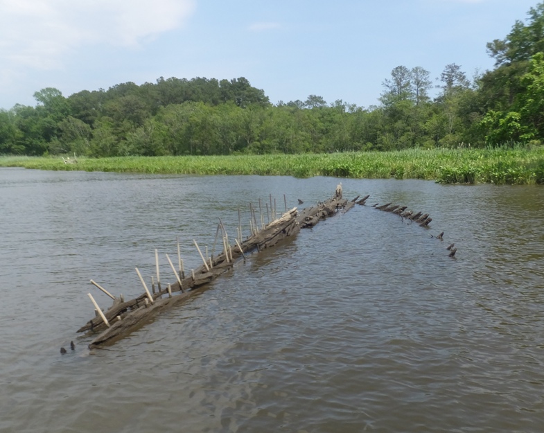 Metal rods and wood above water on the Naticoke River