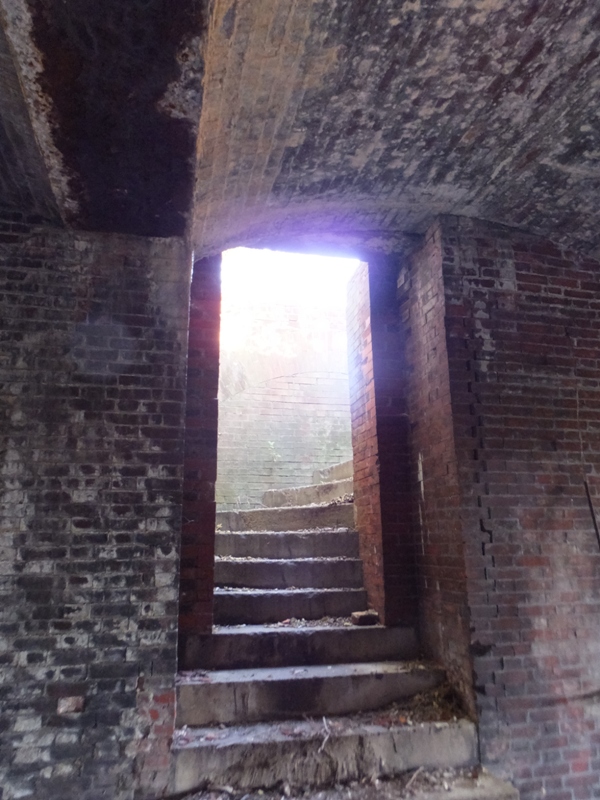 On the left, stone stairs lead to the roof