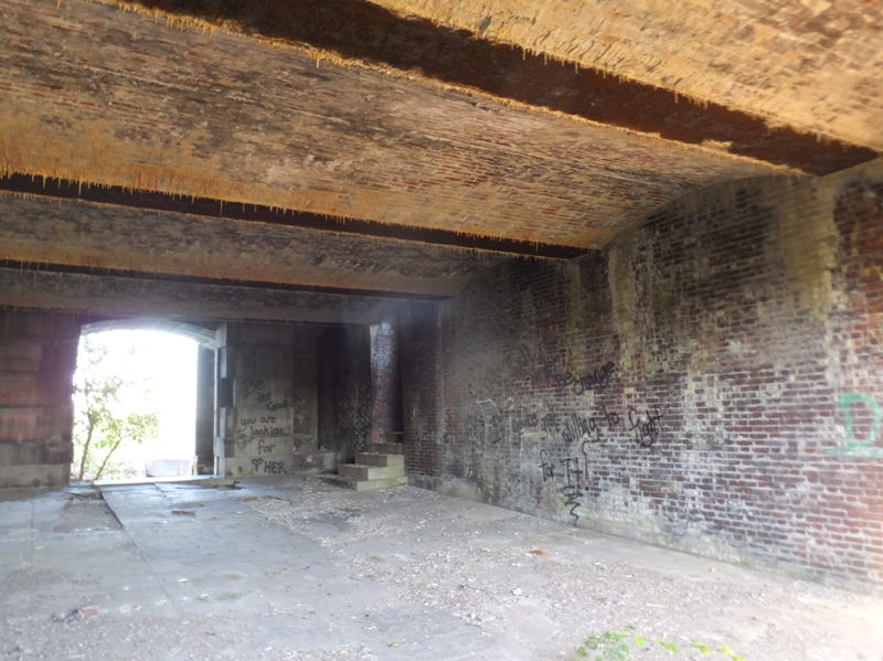 Light shining through entrance with stone stairway
