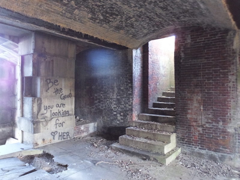 Graffiti by stone stairwell