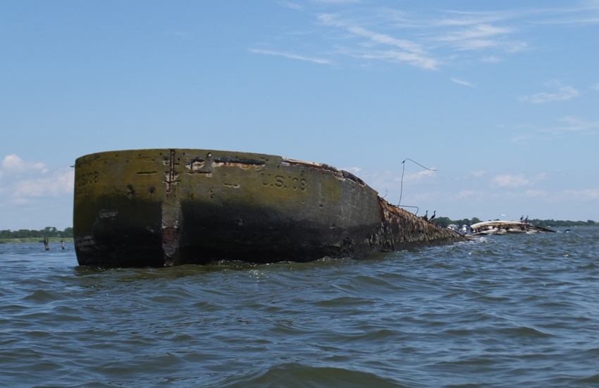 Bow sticking out of the water of barge U.S. 108
