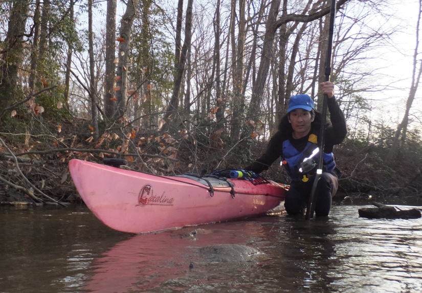 Me at turnaround point, kneeling next to my kayak