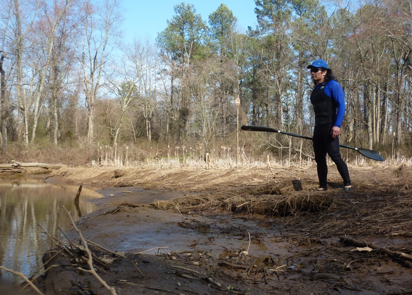 Me exploring on foot, holding paddle