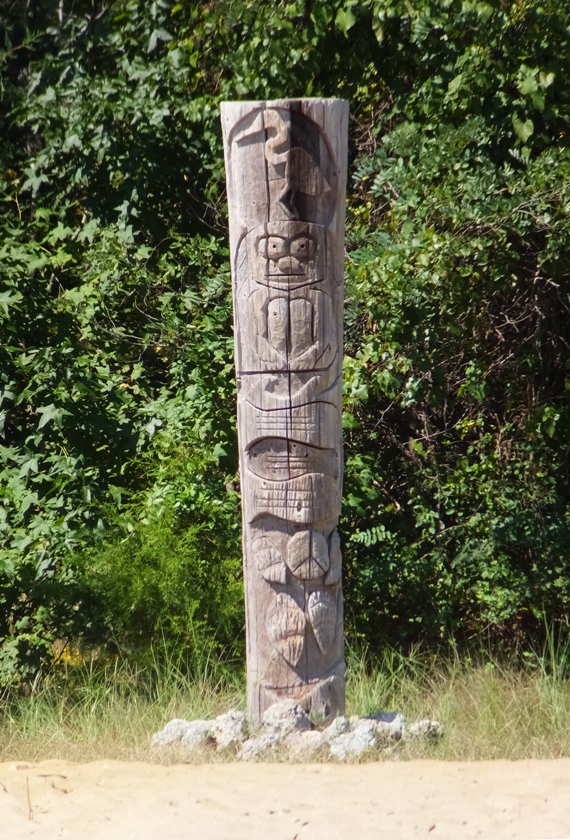 Modern totem pole with cartoonish designs