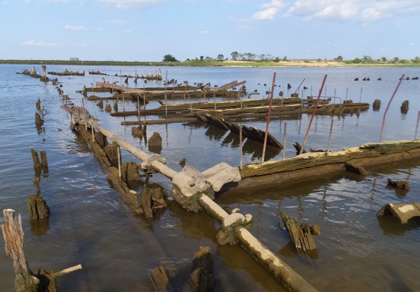 Wood with metal rods and a long pipe