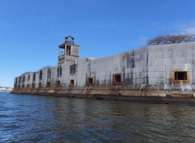 Openings in wall for cannons with lighthouse above