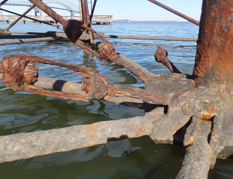 Rusty steel connectors with Key Bridge in background