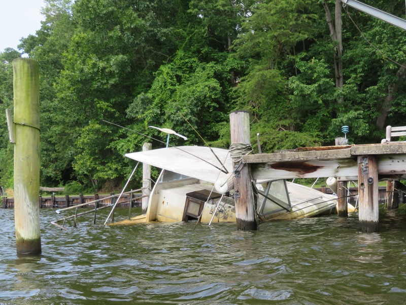 Modern sunken boat at pier