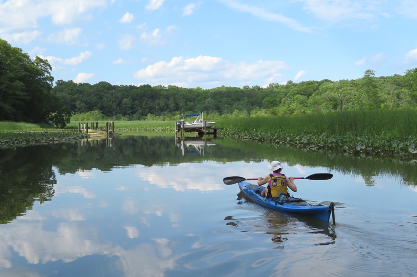 Rear view of Norma kayaking