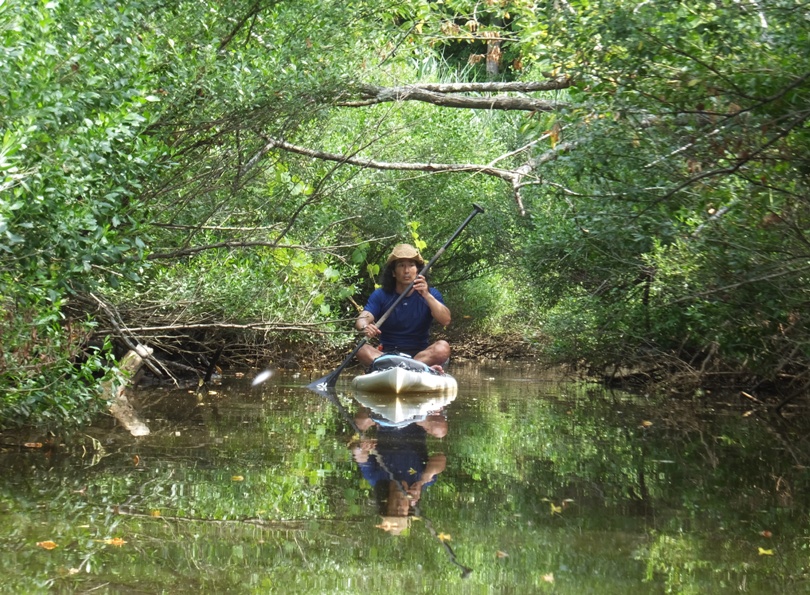 Me sitting on SUP trying to get as far upstream as possible