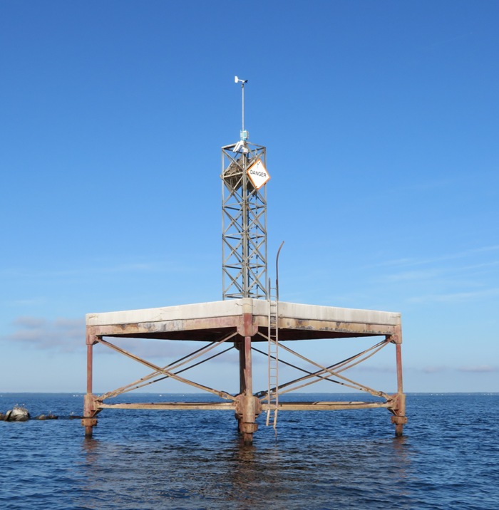 What appears to be a navigational or data collection device station on the water