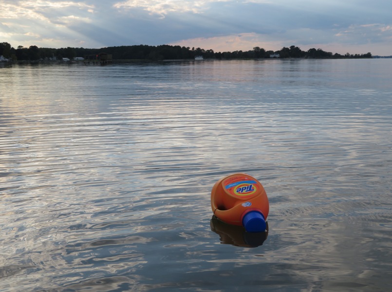 Empty tide container being used to mark a crab pot