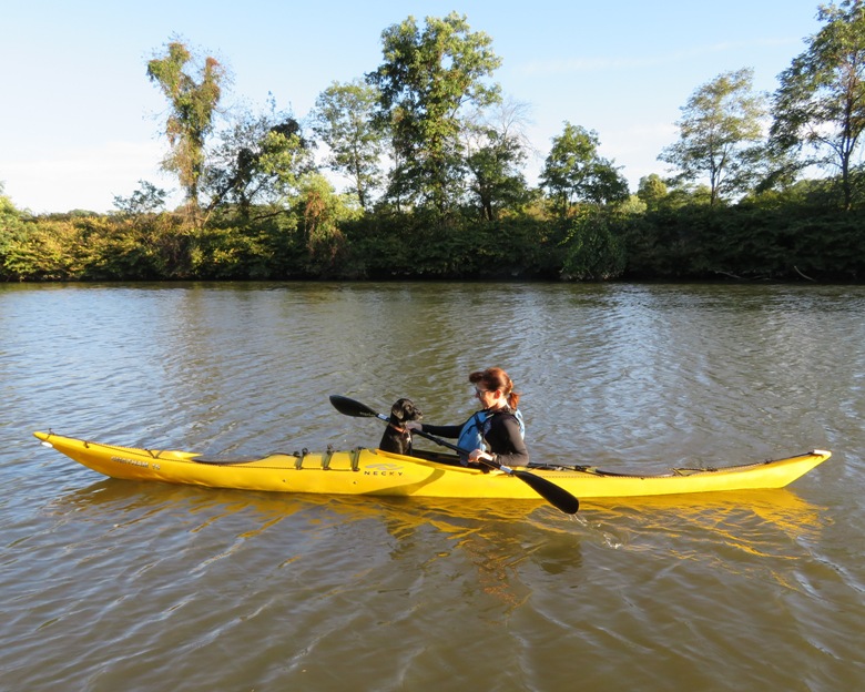 Sara and Cassi facing each other in the kayak