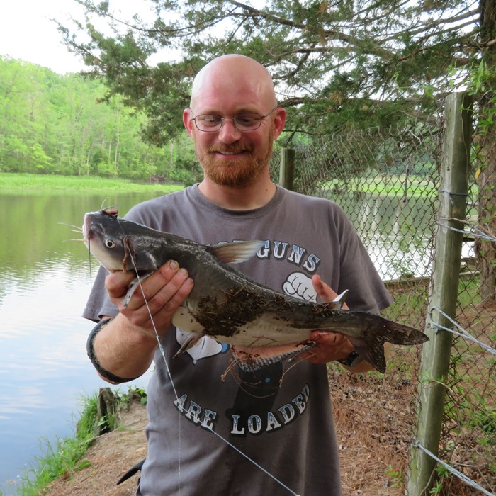 Man holding large catfish