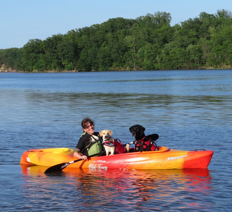 Sara with Daphne and Cassi in her kayak
