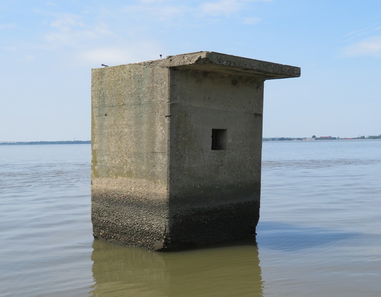 Square concrete structure in the water