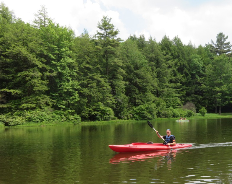 Jimmy solo-paddling a tandem kayak