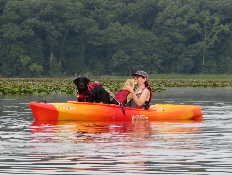 Cassi, Daphne, and Sara in Sara's kayak